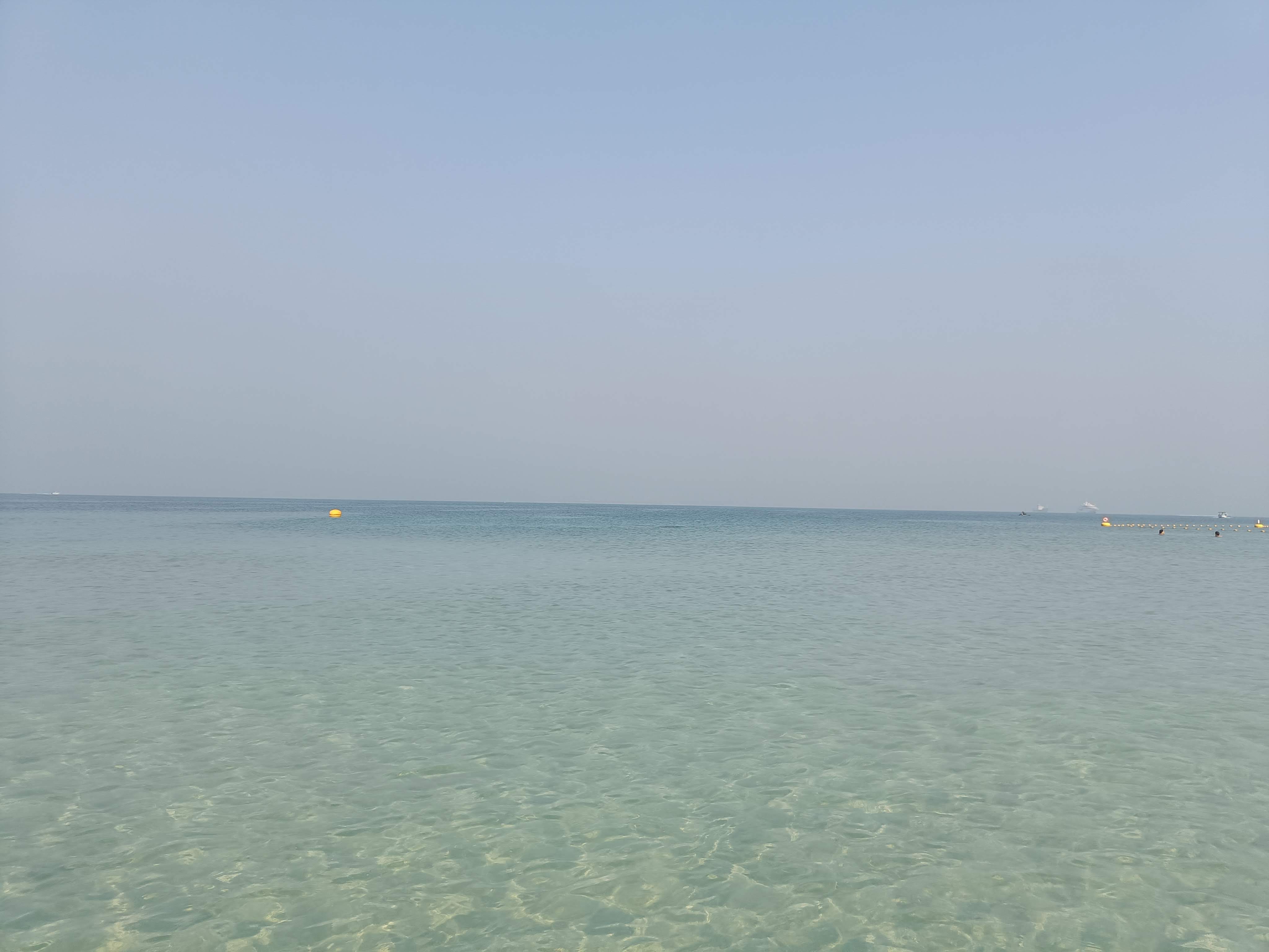 Kite Beach shoreline in Dubai with pristine white sand and clear blue waters